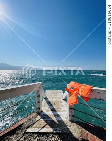 Rocky beach and crystal turquoise water of Ionian Sea in Albania. Rocky beach and crystal turquoise water of Ionian Sea in Albania. 118616024