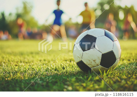 Children playing soccer outdoors. Football training 118616115