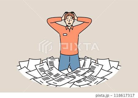 Paperwork and bureaucracy frighten man standing among pile of paper documents and clutching head 118617317