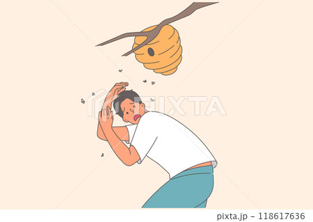 Nest of angry bees above frightened man standing near branch, at risk of anaphylactic shock 118617636