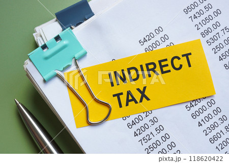 Stack of papers with a note about indirect tax. Stack of papers with a note about indirect tax. 118620422