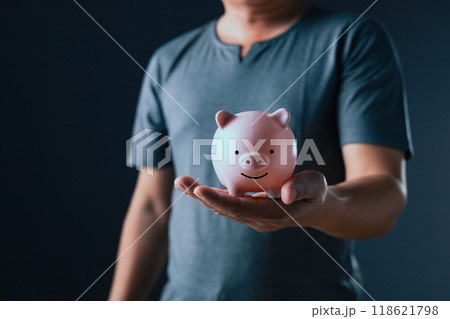 businessman show on the piggy bank on hand, family finance plan concept, fundraising, superannuation, donation, saving, charity, investment, financial crisis concept. 118621798