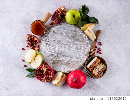 Rosh Hashana concept with honey, apple and pomegranate Rosh Hashana concept with honey, apple and pomegranate 118622611