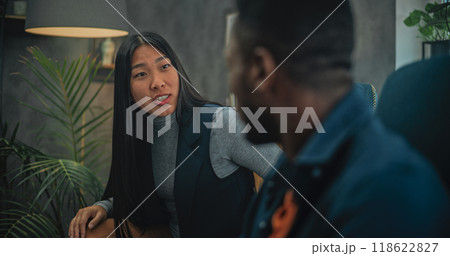 Multiethnic young family having conflict during consultation with psychotherapist 118622827