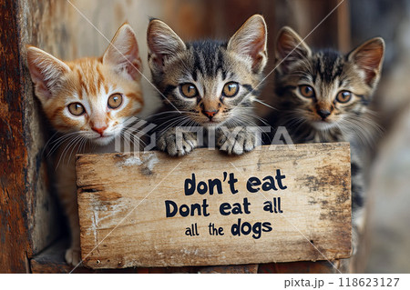 Pets holding Don't eat cats and dogs sign 118623127