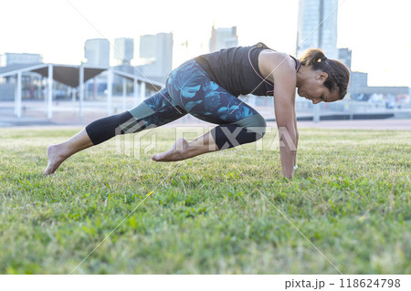 A Young woman doing yoga exercise outdoor A Young woman doing yoga exercise outdoor 118624798