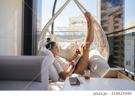 A Cozy Relaxing Reading Nook Complete with a Scenic and Beautiful Balcony View Awaiting You 118625480