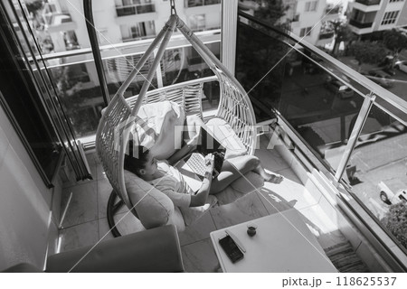 A Cozy Reading Nook Designed in a Modern Apartment with a Relaxing, Soothing Atmosphere 118625537