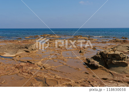 Eroded Coastal Rocks with Tide Pools on a Mediterranean Shore 118630038