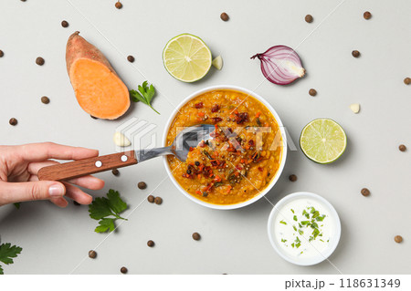 Mashed sweet potatoes in bowl, ingredients and spoon in hand on white background, top view Mashed sweet potatoes in bowl, ingredients and spoon in hand on white background, top view 118631349