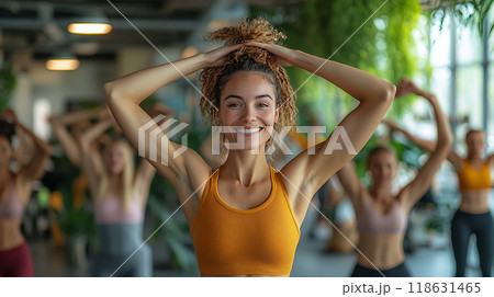 Group of colleagues doing stretch exercises in a modern workspace, high resolution 118631465