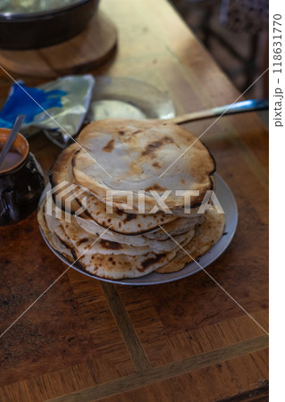 Pancakes cooked by grandma in the oven in the village. Old Slavic food Pancakes cooked by grandma in the oven in the village. Old Slavic food 118631770