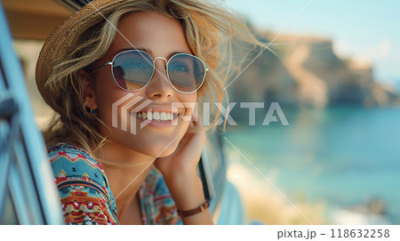 Pretty young woman leaning out of car window, taking photo, summer travel, high resolution image 118632258