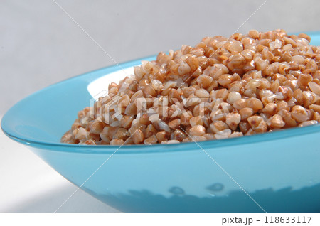 groats in plate on white 118633117