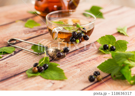 herbal tea from currant leaves and berries 118636317