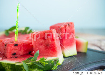 pieces of ripe red watermelon, close-up, on a board 118636324
