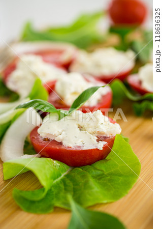 tomato wedges with cottage cheese filling and garlic, spicy appetizer 118636325