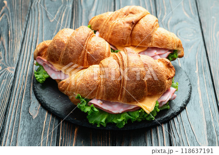 Croissant sandwich with salad ham and cheese . Top view 118637191