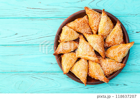 Homemade triangle puff pastry with meat on rustic background . Samosa 118637207