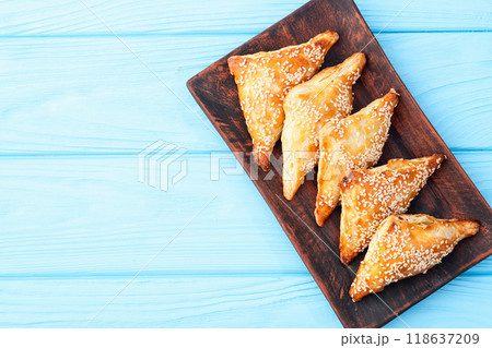 Homemade triangle puff pastry with meat on rustic background . Samosa 118637209