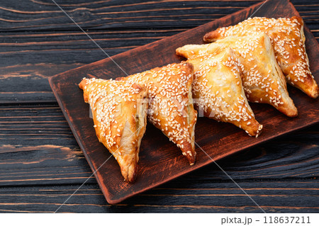 Homemade triangle puff pastry with meat on rustic background . Samosa 118637211