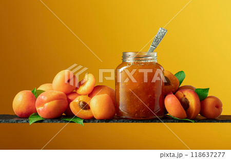 Apricot jam in glass jar and fresh fruits. Apricot jam in glass jar and fresh fruits. 118637277