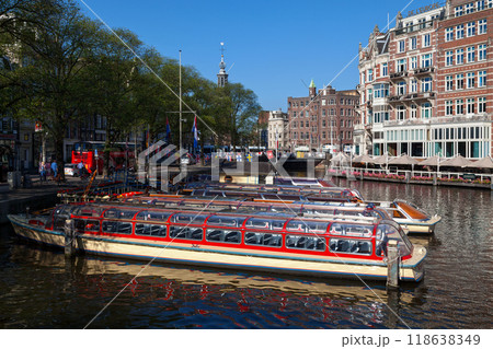 Riverboats moored on a canal in Amsterdam Riverboats moored on a canal in Amsterdam 118638349