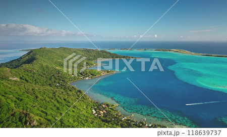 Aerial view of Bora Bora island with turquoise lagoon, coral reef, boats sailing, green tropical forest, beach and mountain. French Polynesia tropical paradise, perfect exotic summer travel vacation. 118639737