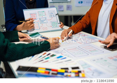 UX developer and ui designer brainstorming about mobile app interface wireframe design with customer breif and color code, User experience concept. 118641890