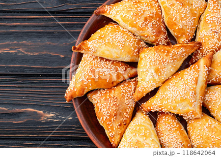 Homemade triangle puff pastry with meat on rustic background . Samosa 118642064