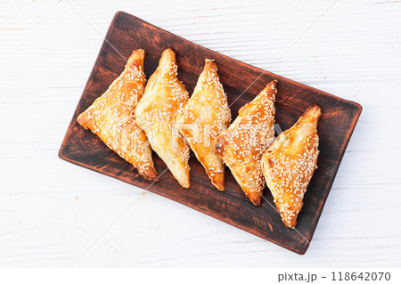 Homemade triangle puff pastry with meat on rustic background . Samosa 118642070