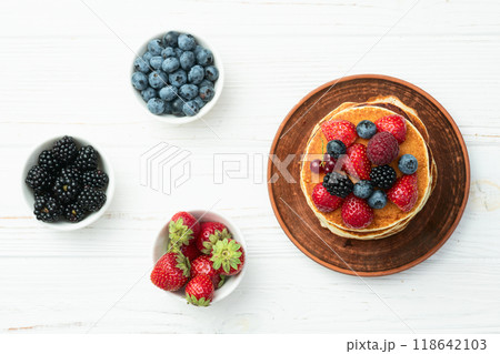 Stack of homemade american pancakes with berries . Top view Stack of homemade american pancakes with berries . Top view 118642103