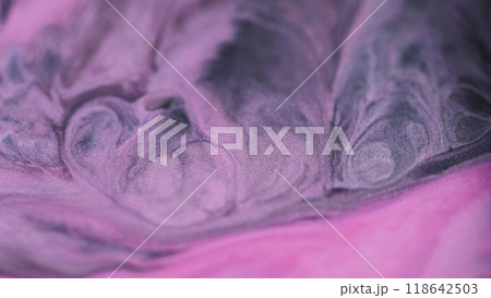 Shining wave. Glitter paint. Sparkling purple fluid. Glowing abstract emulsion pink black color mixing liquid ink pigment art background. 118642503