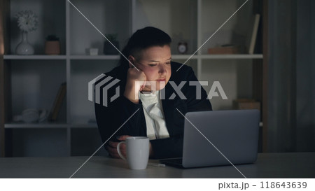 Late work. Job stress. Fatigued bored business woman employee falling asleep at workspace office during routine night shift with emotional burnout. Late work. Job stress. Fatigued bored business woman employee falling asleep at workspace office during routine night shift with emotional burnout. 118643639