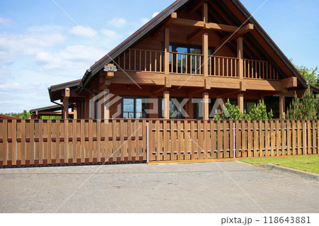 Modern eco-friendly wooden house with fence Modern eco-friendly wooden house with fence 118643881