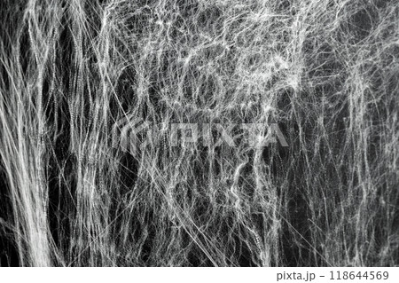 Spooky creepy cobweb spiders web covered a black background. Abstract halloween background. Spooky creepy cobweb spiders web covered a black background. Abstract halloween background. 118644569