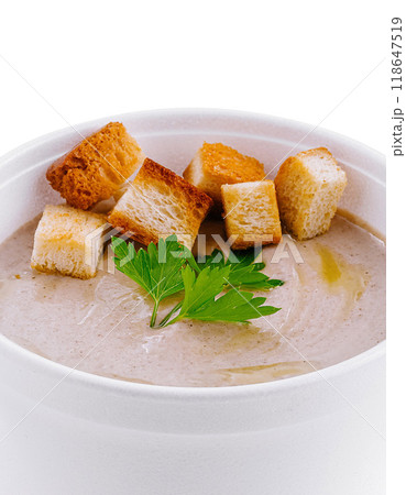 Mushroom cream soup with croutons in a white to-go cup 118647519