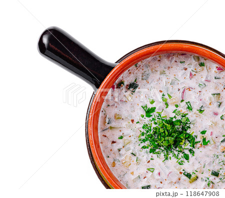 Traditional russian cold soup okroshka with vegetables in clay pot isolated on white background Traditional russian cold soup okroshka with vegetables in clay pot isolated on white background 118647908