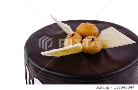 Delicious chocolate cake with dripping icing and white chocolate garnish Delicious chocolate cake with dripping icing and white chocolate garnish 118648044