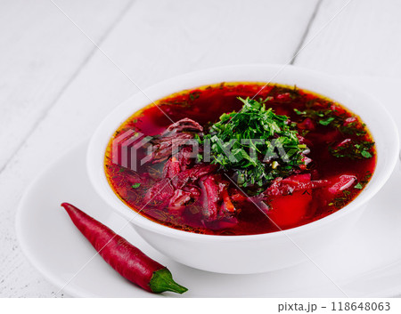 Traditional ukrainian russian borscht soup with beetroot in white bowl 118648063