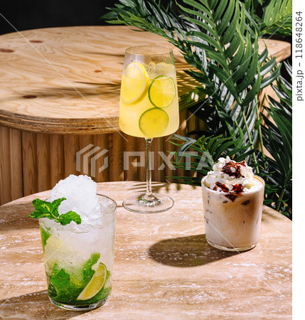 Enjoying a moment of relaxation with delicious and refreshing drinks on a sunny day Enjoying a moment of relaxation with delicious and refreshing drinks on a sunny day 118648264