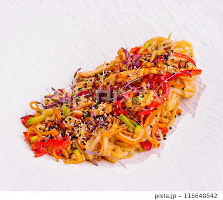 Udon noodles with chicken and vegetables sprinkled with sesame seeds Udon noodles with chicken and vegetables sprinkled with sesame seeds 118648642