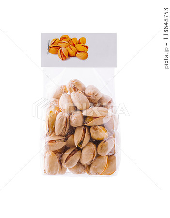 Transparent plastic bag filled with pistachios standing up on white background 118648753