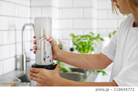 Little Girl Making A Milkshake And Shaking It With A Sports Shaker In The Kitchen 118648772