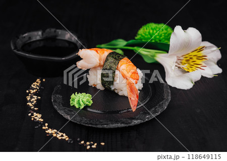 Delicious king prawn nigiri sushi served on black slate plate 118649115