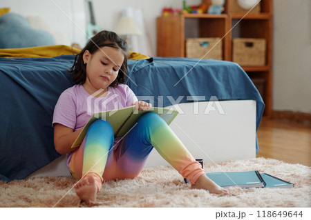 Girl Writing In Notebook At Home 118649644