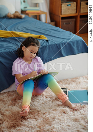 Girl Painting In Coloring Book 118649645
