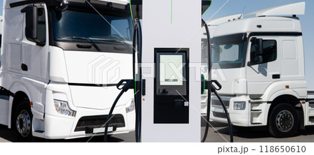 Electric vehicles charging station on a background of a trucks. Concept 118650610