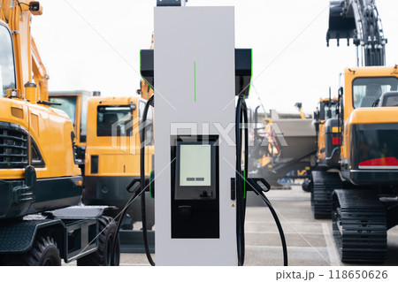 Electric construction machines with charging station. Concept. Electric construction machines with charging station. Concept. 118650626