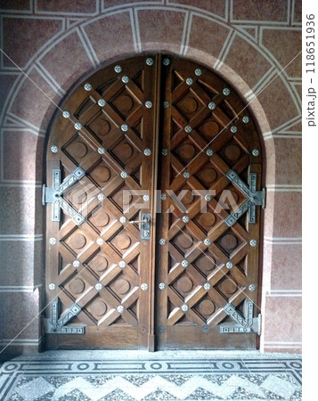 Doors in the castle church old door antique arched medieval concept material wood metal stone wall vertical Doors in the castle church old door antique arched medieval concept material wood metal stone wall vertical 118651936